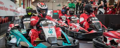 Karting race pilots ready for departure in pitlane